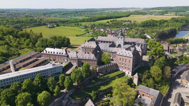 town below floreffe abbey belgium alongside sombre river nature architecture reveals left to right circling aerial shot view abbaye de 