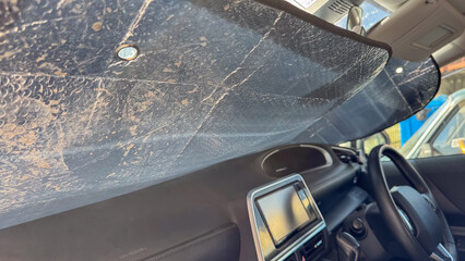 Foil sun visor for car windshield. 