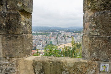 Scenic View of San Sebastian from a Historic Stone Wall