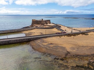 Arrecife in Lanzarote, aerial view of town, fortress and sandy beach