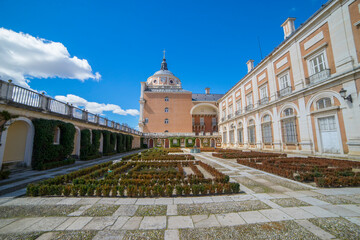 Royal Palace of Aranjuez showcases elegant facade and serene gardens in Community of Madrid, Spain,...