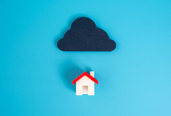 Black cloud over the house. Concept of the impending crisis in the real estate market. Home...