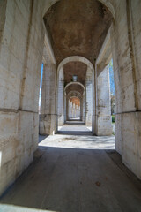 Fototapeta premium Exploring the grand arches of the 18th century Palacio de Aranjuez in Aranjuez, Spain, a historic royal residence and museum