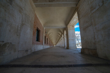 Exploring architectural beauty in Aranjuez, Spain at the Old Arcs passage near the historic royal...