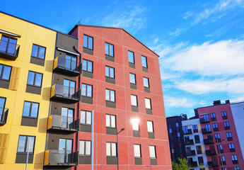 Modern facade building close up. Multicolore facade. Modern residential facade with Windows....