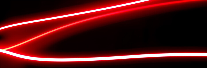 Dark abstract background with red neon glowing lines. Bold neon red light trails on a dark surface,...