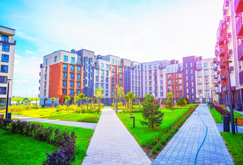 Apartment courtyard. Block house with courtyards with chairs at Walkway. Cityscape of residential area with modern apartment buildings. Pathway at New house. Modern courtyard at Residential building.