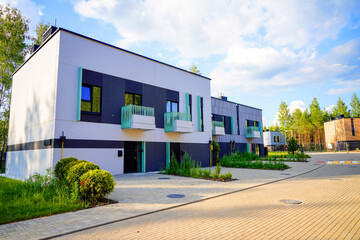 Modern townhouse in suburban area. New apartment building in sustainable enviroment. Two-story...