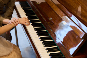 Stunningly Beautiful Hands Skillfully Playing the Piano with an Elegant Reflection