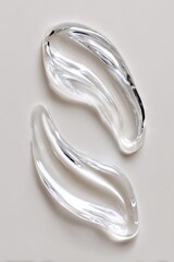 Naklejka premium Close-up of Transparent Glass Eye Curls with Curved and Swirling Design on Light Background for Decorative Art and Craft Projects