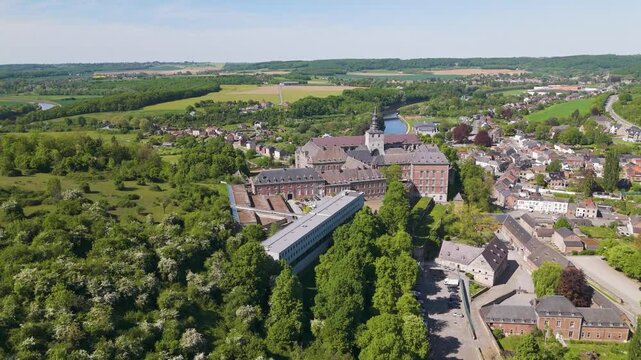 town below parked cars main building floreffe abbey belgium perspective area's layout from right to left wide view abbaye de expansive 