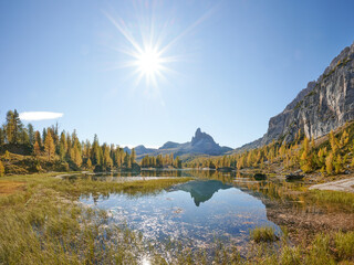 Naklejka premium autumn in the mountains with a lake and a mountain in the background in the dolomites