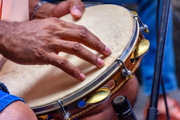 Tambourine player hands in a samba performance on the streets of Rio de Janeiro