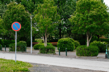 Street park area with trees and no parking sign in Reykjavik, Iceland