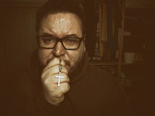 A grown man hopes for a miracle and prays.