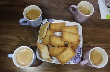 Four cup of tea and cookies for breakfast.