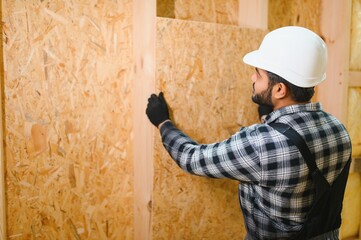 Construction of modular houses. Indian construction worker or engineer at construction site