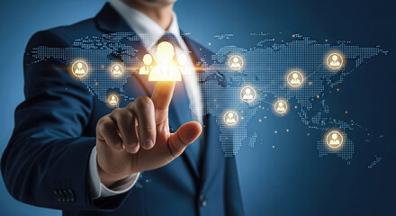 A businessmans finger touches a glowing user icon on a digital world map, illustrating global connections and networking