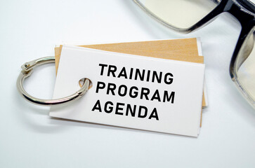 Training Program Agenda on notepad with keyring
