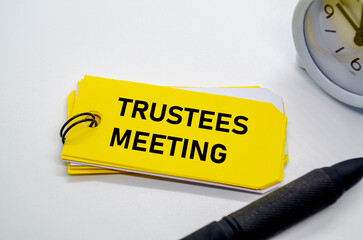 Trustees Meeting notepad with keyring on yellow background