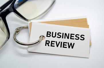 Business Review notepad with paperclips