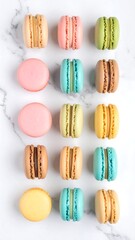 Obraz premium Colorful macarons arranged on marble (2)