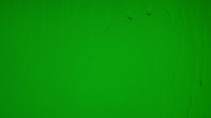 Wet glass surface with raindrops on green chroma key background - Powered by Adobe