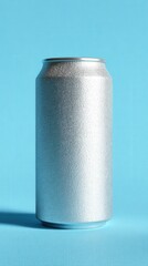 A plain silver metallic can stands upright on a blue textured surface with a matching blue background.