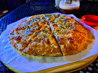 Delicious cheesy pizza slices, perfectly seasoned and ready to eat. Ideal for food blogs,...