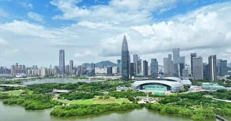 Shenzhen Talent Park Complex showcases vibrant urban landscape with green spaces and skyline - Powered by Adobe