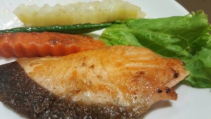 Fresh Grilled salmon with carrot and potato in white plate , die cut salmon grilled
