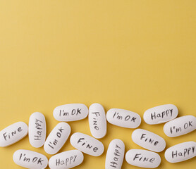 Medication pills with "Joy", "fine" and "I´m OK" written with copy space. Suicide prevention