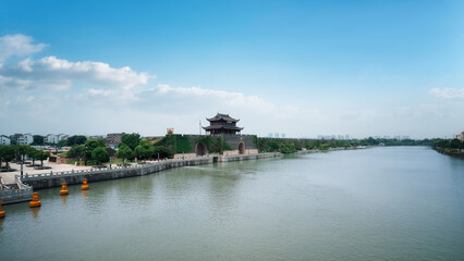 Scenic view of ancient city wall by the river under clear sky
