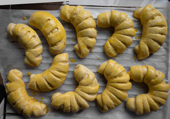 Baking crescent rolls in a kitchen with warm golden color and inviting aroma during a cozy afternoon