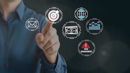 Man interacting with virtual digital icons for email, target, web, security, analytics, and risk...
