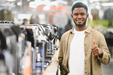 Man choosing coffee machine in mall