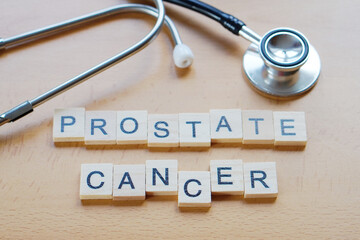 Prostate Cancer Awareness Concept with Wooden Letters and Stethoscope