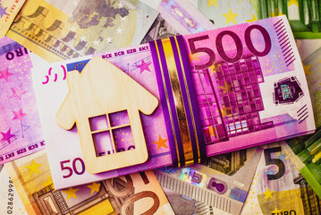 Symbol of home and family against the background of the Euro currency
