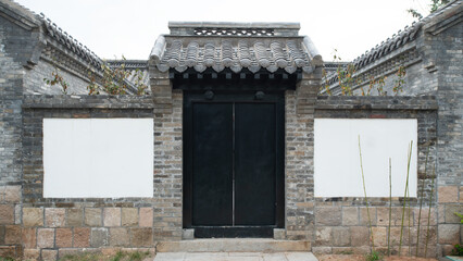 Traditional Chinese-style gate with brick and stone construction