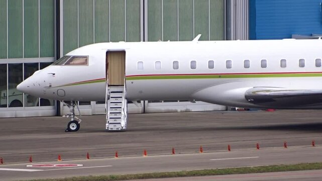 high end business jet parked fbo presented scene illustrates luxurious lifestyle billionaires stairs deployed door open inviting travel close up view billionaire private 