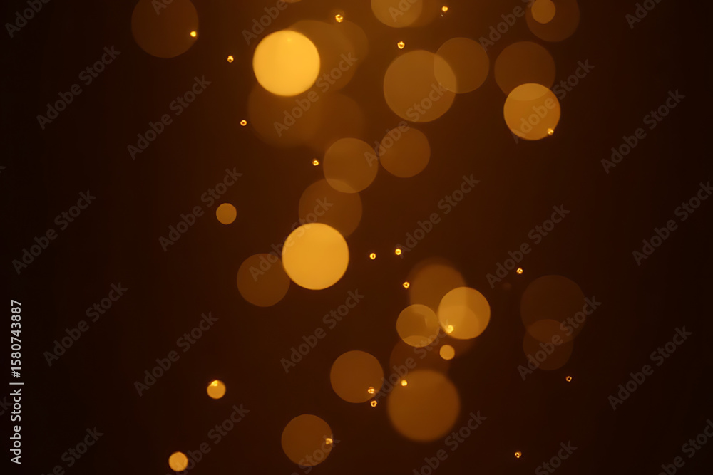 Poster abstract background of blurred golden bokeh circles on a dark brown backdrop creating a soft and dre