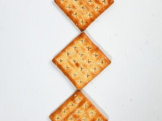 isolated square sweet cracker with sprinkled sugar on top on white background