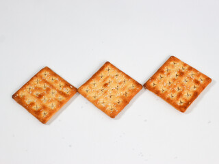 isolated square sweet cracker with sprinkled sugar on top on white background