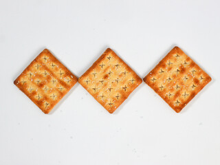 isolated square sweet cracker with sprinkled sugar on top on white background