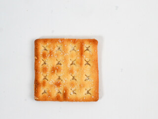 isolated square sweet cracker with sprinkled sugar on top on white background