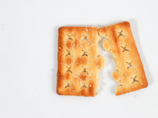 isolated sweet square cracker with sprinkled sugar on top split in half on white background