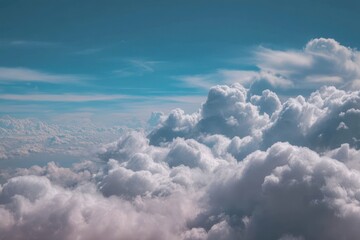 Ethereal sky view with billowy clouds and bright blue sky