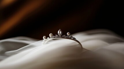 Obraz premium silver wedding crown resting on ivory fabric, fairy tale bridal style