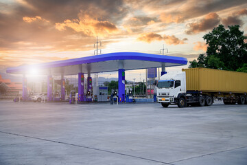 Gasoline pump nozzle sign. Fuel pump petrol station,Oil and Gas station at sunrise and orange sky .