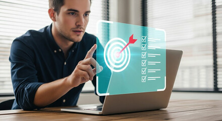 Man points to a digital target and checklist on a laptop screen